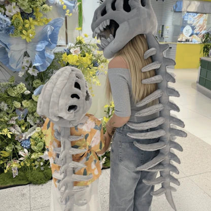 Mum and son back view showing full DinoRoar spine and tail at a flower shop